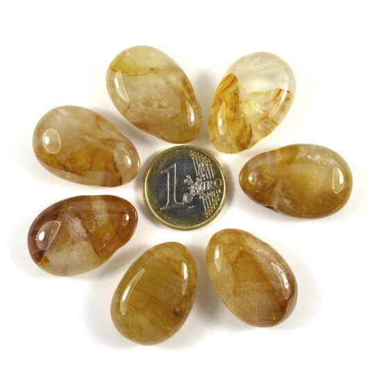 Schöner gebohrter Trommelstein aus Golden Healer